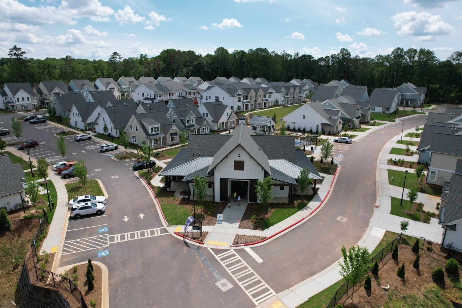 Build-to-rent community entrance with clubhouse.